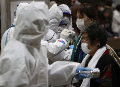 Evacuees are screened for radiation contamination at a testing centre in Koriyama, a city in the same prefecture as the Fukushima nuclear plant.