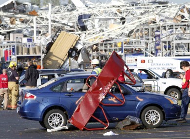 Emergency crews assess the damage in North Carolina after storms cut across the state.