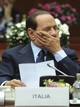 Silvio Berlusconi's coalition partners are dragging their heels on allowing the government to enact reforms demanded by the EU.