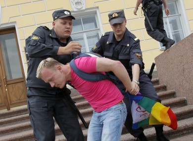 An LGBT activist is detained during protests in St Petersburg earlier this month
