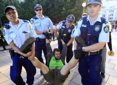 A protester being taken away by police from a protest in Sydney at the weekend