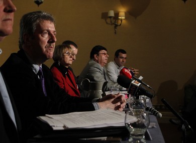 Steve Travers (left), a survivor of the Miami Showband Massacre, speaks to reporters alongside members of the victims' families.