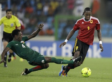 Angola's Manucho, right, is challenged by Burkina Faso's Mamadou Tall