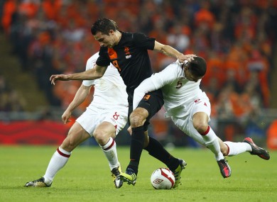 Robin van Persie battles for the ball with England's Scott Parker (left) and Chris Smalling.