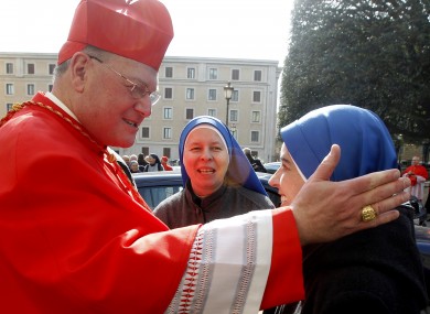 File photo of New York's Cardinal Archbishop of New York, Timothy Dolan, greeting some nuns.
