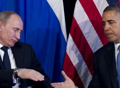 Putin and Obama shake hands in their meeting yesterday