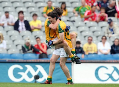 Patrick Kennelly of Meath celebrates with a team mate after his county's win.