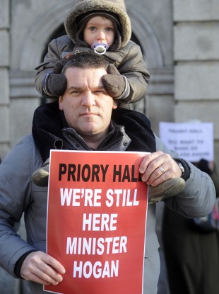 Darren Kelly and his 3 year old son Evan at a Priory Hall protest last December.