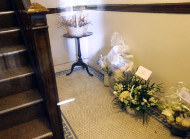 Flowers addressed to the parents of Rehma Sabir are seen in the entryway of their apartment building in Cambridge, Massachusetts