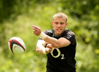 Ian Madigan spins a pass in training.