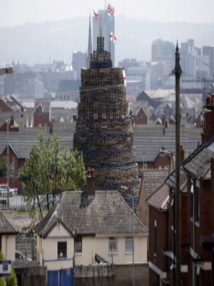 A massive bonfire dwarfs the houses in close to Lanark Way in West Belfast.