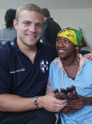 Ian Madigan with a female worker from the Pittard factory.