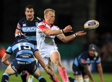 Leigh Halfpenny and Sam Warburton pursue Luke Marshall as he receives a pass.
