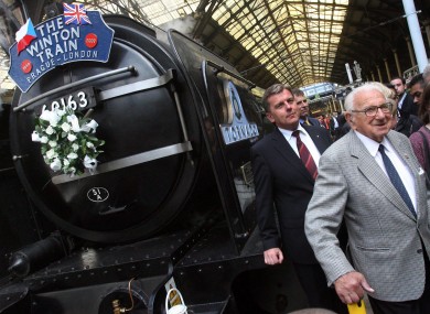 Nicholas Winton, seen here at age 100 in 2009, beside the 'Winton Train' at Liverpool Street Station in London.