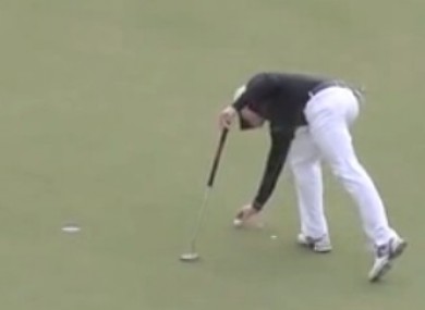 Dyson tapping down on the line of his putt, the move that resulted in today's ruling.