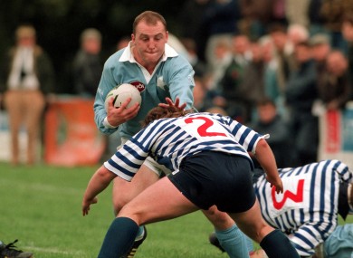 Keith Wood of Garryowen is tackled by Blackrock's Shane Byrne in 1994.