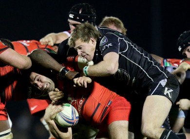 Kieran Marmion tackles Jean-Marc Doussain of Toulouse.