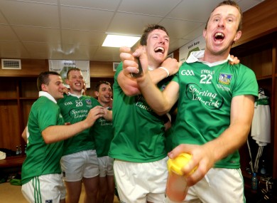 Limerick's Seamus Hickey and Niall Moran celebrate in the dressing room after the Munster final.