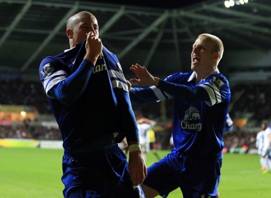 Barkley kisses the Everton crest.