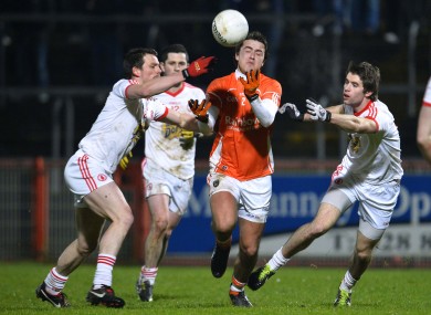 Armagh's Andy Mallon surrounded by Tyrone players.