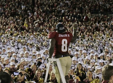 Florida State's Timmy Jernigan celebrates with fans.