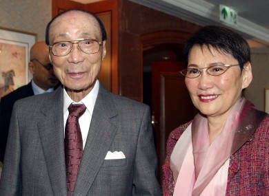 Hong Kong movie producer Run Run Shaw poses with his wife Mona Fong in Hong Kong.