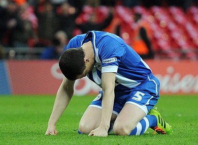 Wigan Athletic's Gary Caldwell looks dejected after missing his teams first penalty.