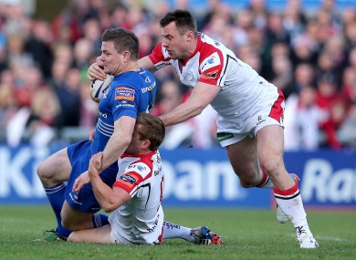 Leinster's Brian O'Driscoll is tackled by Tommy Bowe and Paul Marshall of Ulster.